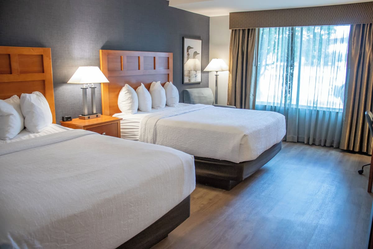 Premium bedding, pillow-top beds, desk, laptop workspace