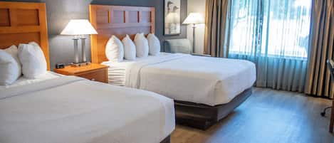 Premium bedding, pillow-top beds, desk, laptop workspace