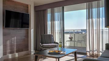 Premier Suite, 1 King Bed with Sofa bed, Balcony | Living area | 27-inch LCD TV with satellite channels, TV, iPod dock