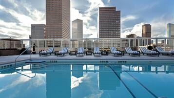 Outdoor pool, a heated pool, pool umbrellas, pool loungers