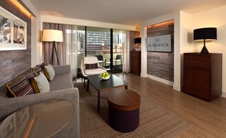 Premier Suite | Living room | 27-inch LCD TV with satellite channels, TV, iPod dock