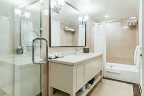 Combined shower/bathtub, designer toiletries, hair dryer, bathrobes