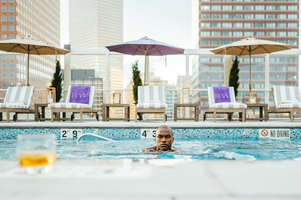 Outdoor pool, a heated pool, pool umbrellas, sun loungers