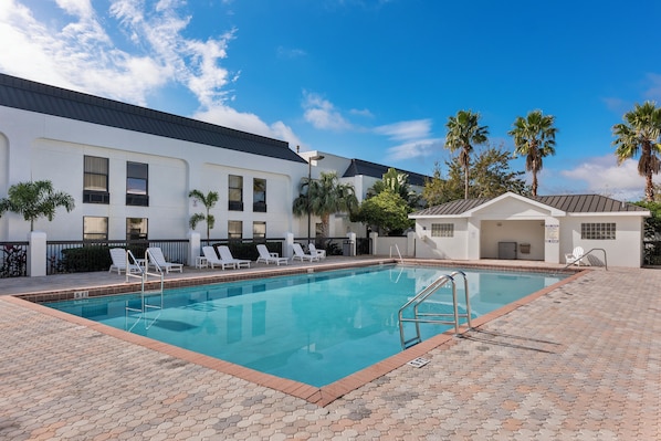 Outdoor pool, open 9 AM to 10 PM, pool loungers