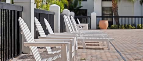 Outdoor pool, open 9 AM to 10 PM, pool loungers