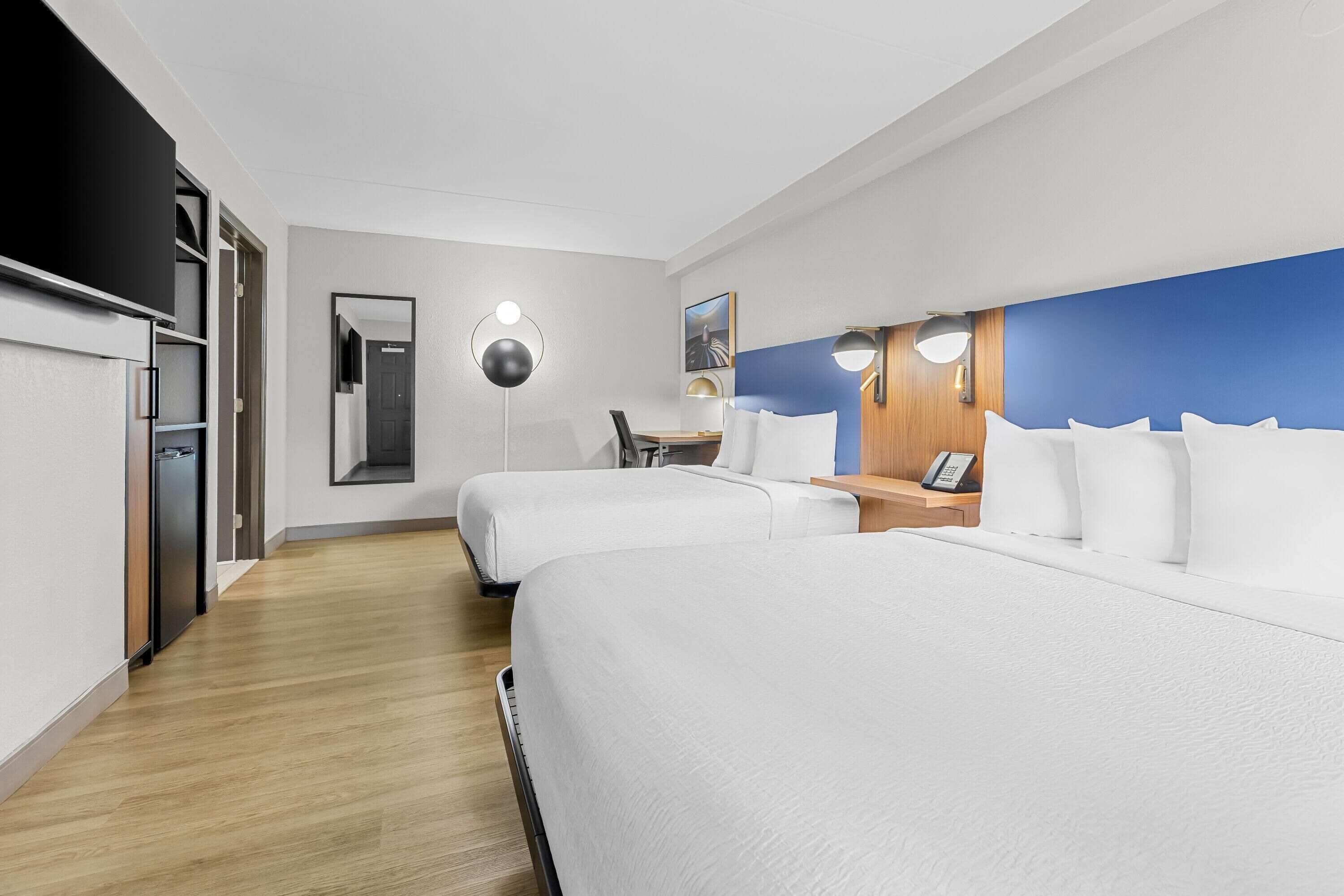 Room, 2 Queen Beds, Mobility Accessible, Non Smoking (Roll-in Shower) | Premium bedding, desk, iron/ironing board, free cribs/infant beds