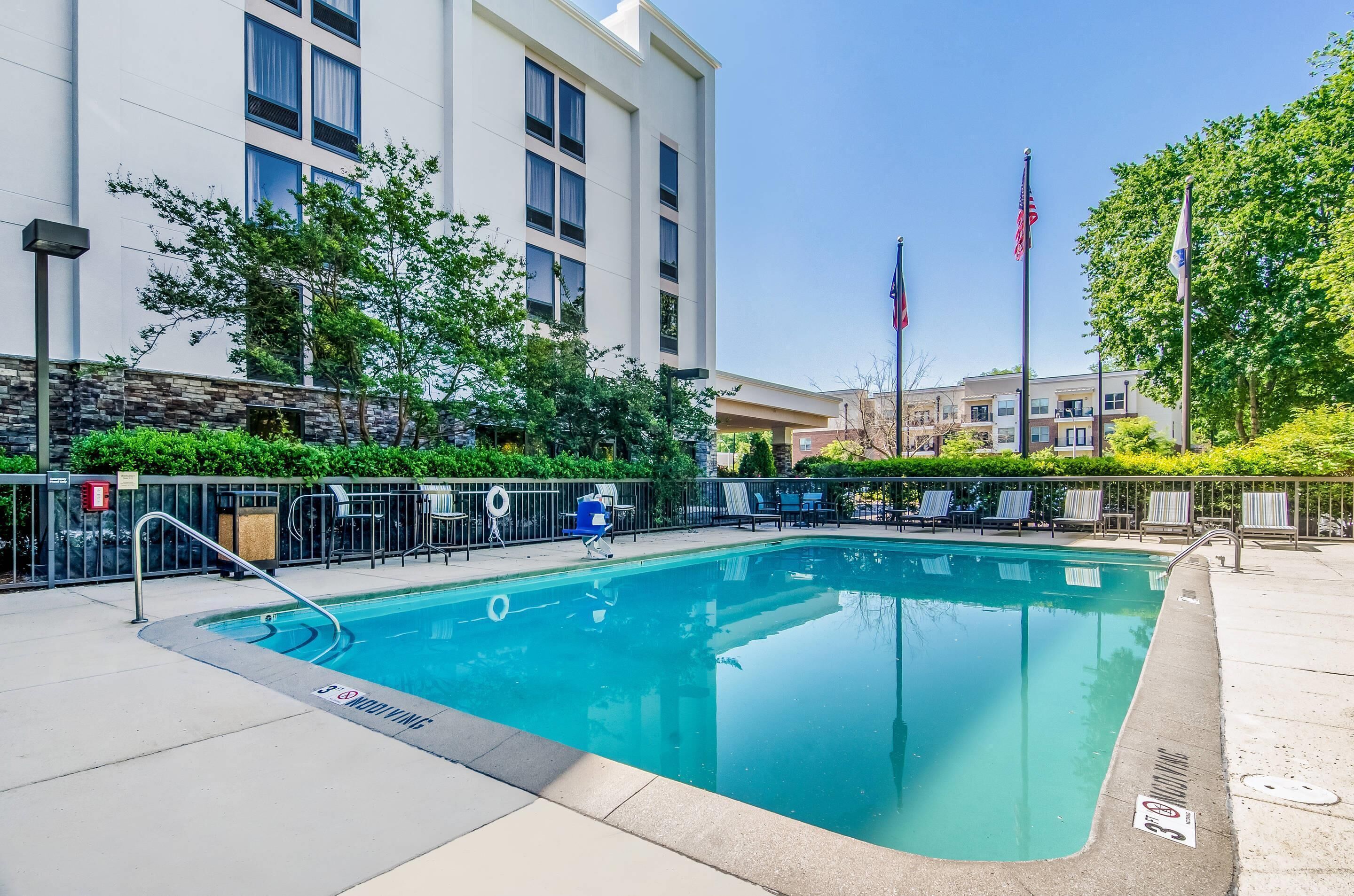 Seasonal outdoor pool, open 10:00 AM to 8:00 PM, pool umbrellas