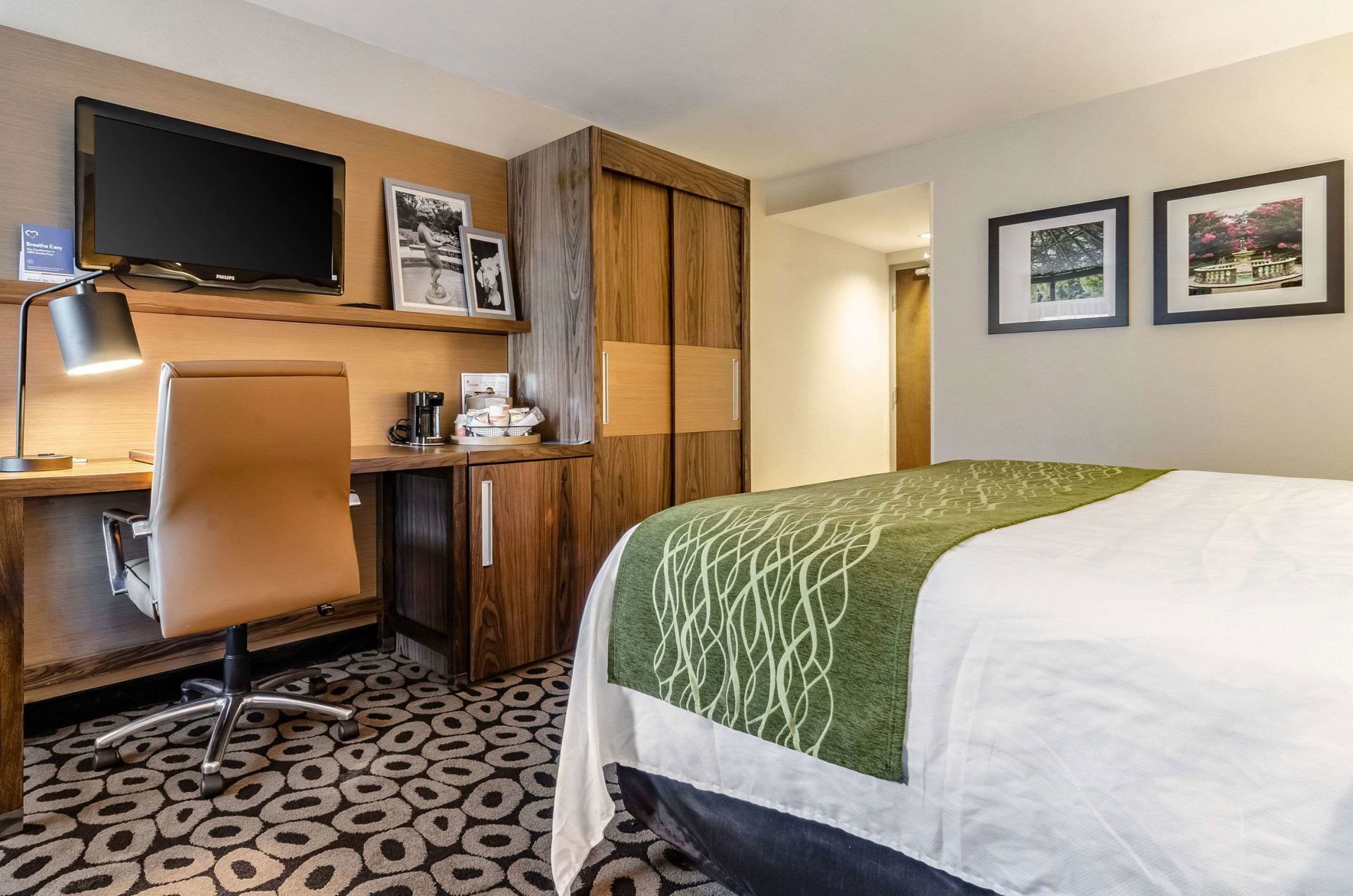 Premium bedding, desk, laptop workspace, blackout drapes