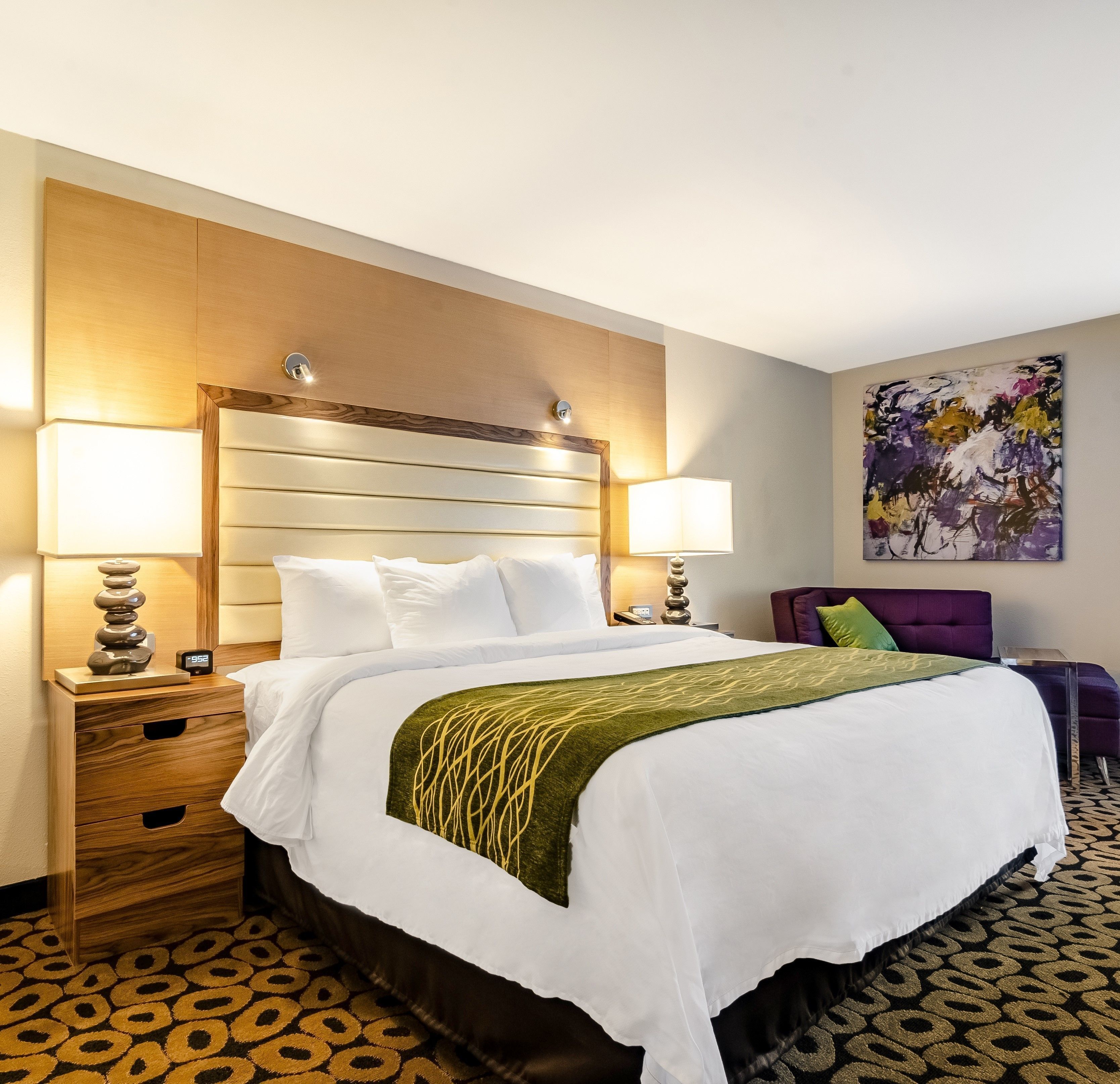 Premium bedding, desk, laptop workspace, blackout drapes