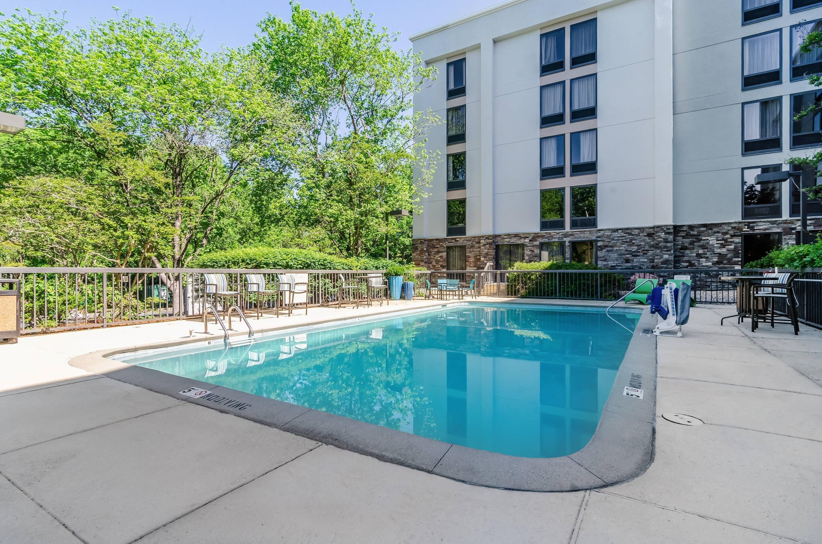 Seasonal outdoor pool, open 10:00 AM to 8:00 PM, pool umbrellas