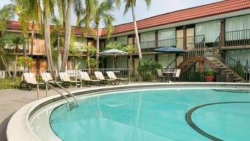 Outdoor pool, open 9:00 AM to 10:00 PM, pool umbrellas, pool loungers