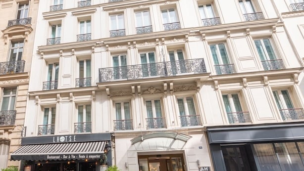 A multi-story building with a restaurant named "L'HOITE" at the ground level. - Atlantic Hotel (Paris)