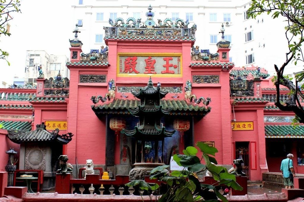 A traditional Chinese temple with ornate architecture and red walls.