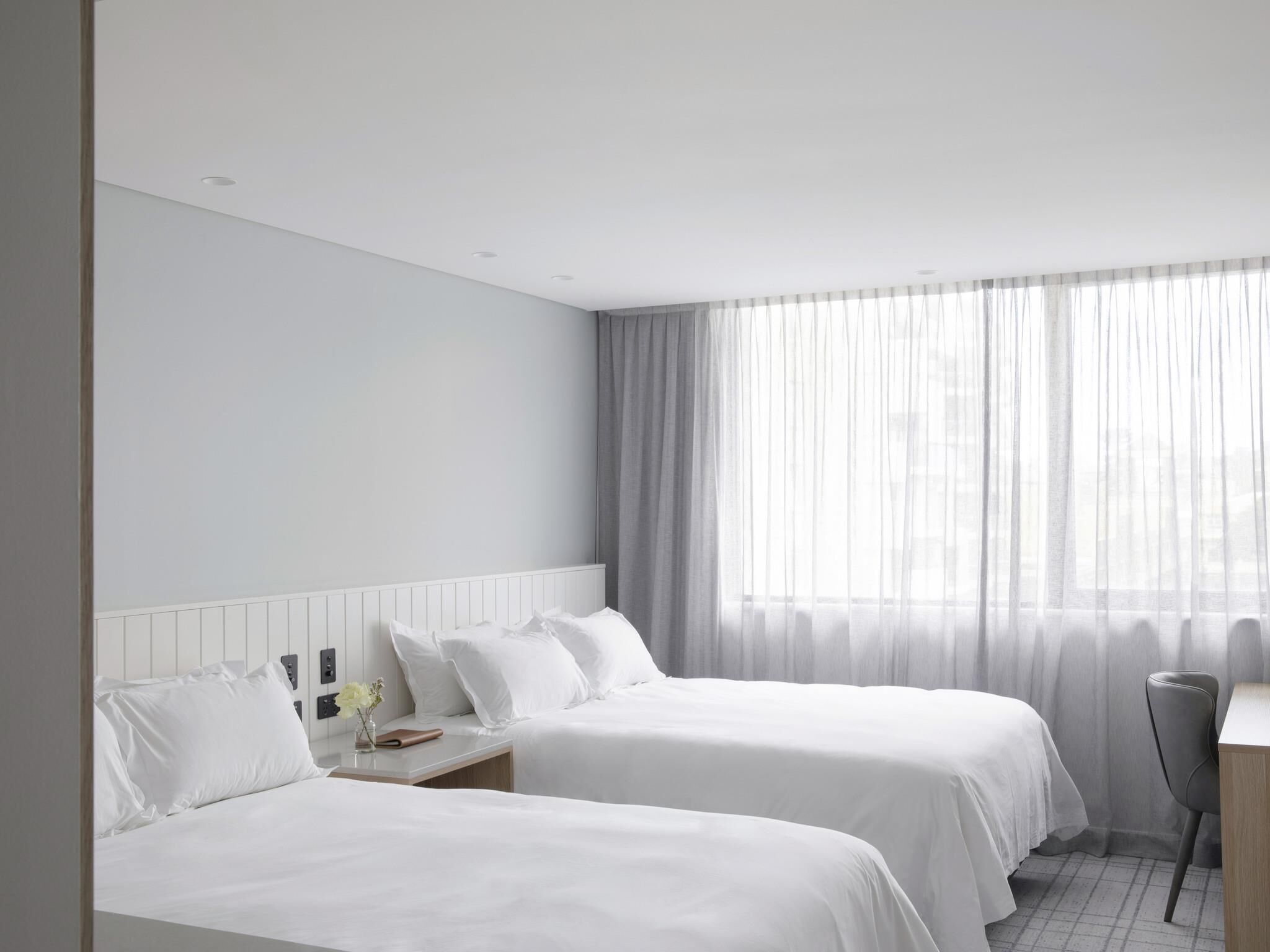 Village Superior Twin | Pillow-top beds, minibar, in-room safe, laptop workspace