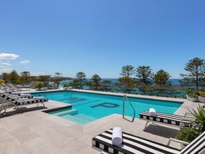 Outdoor pool, pool umbrellas, sun loungers