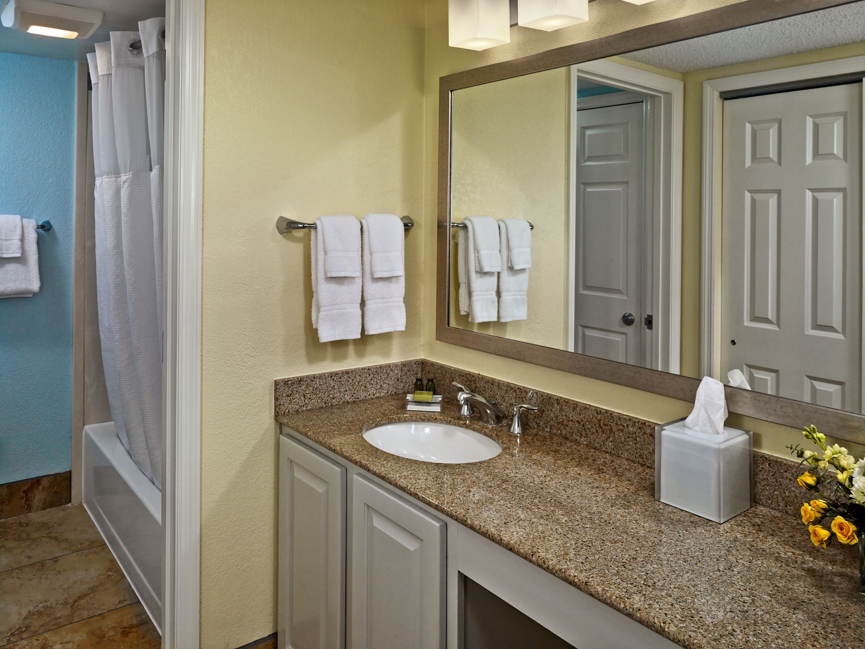 separate bathtub and shower, eco-friendly toiletries, hair dryer, towels