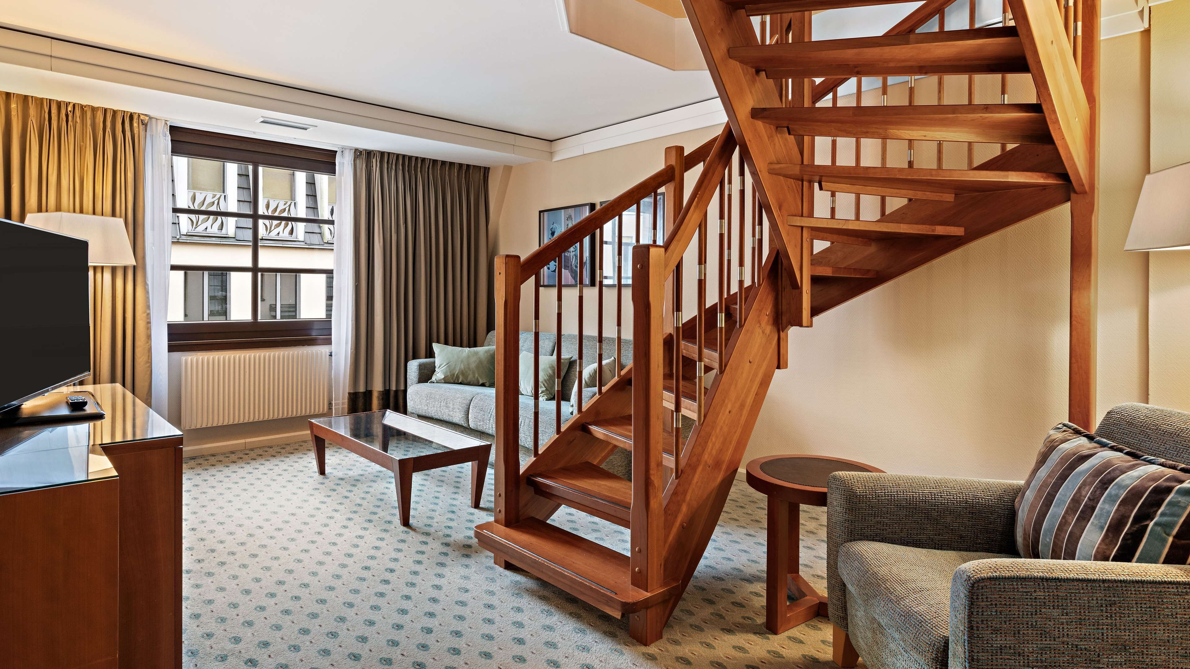 junior suite, 1 king bed (duplex) | living area | lcd tv, mp3 dock