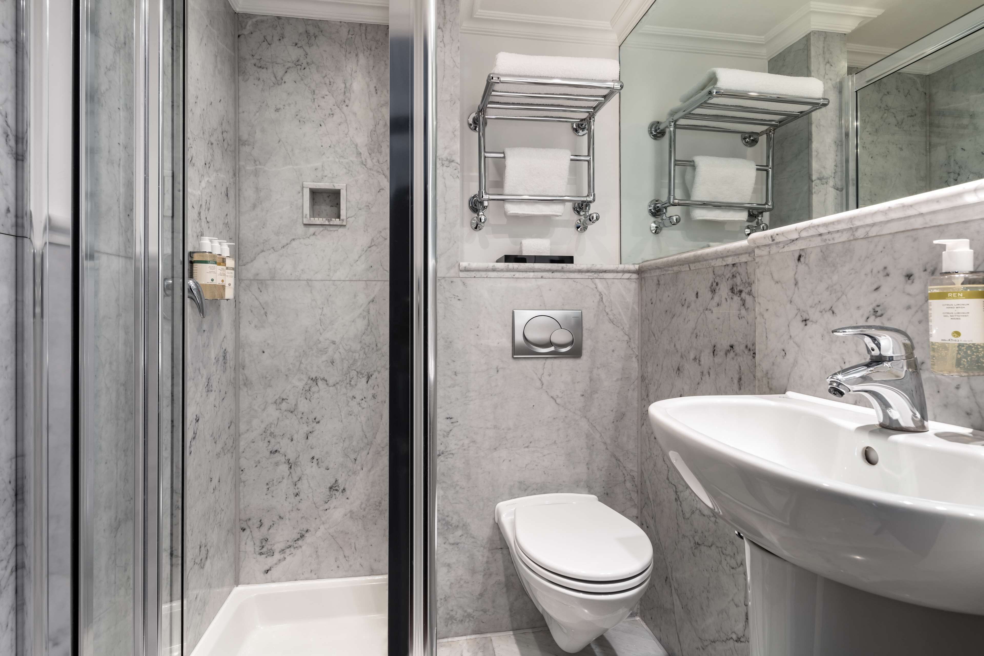 shower, designer toiletries, hair dryer, towels