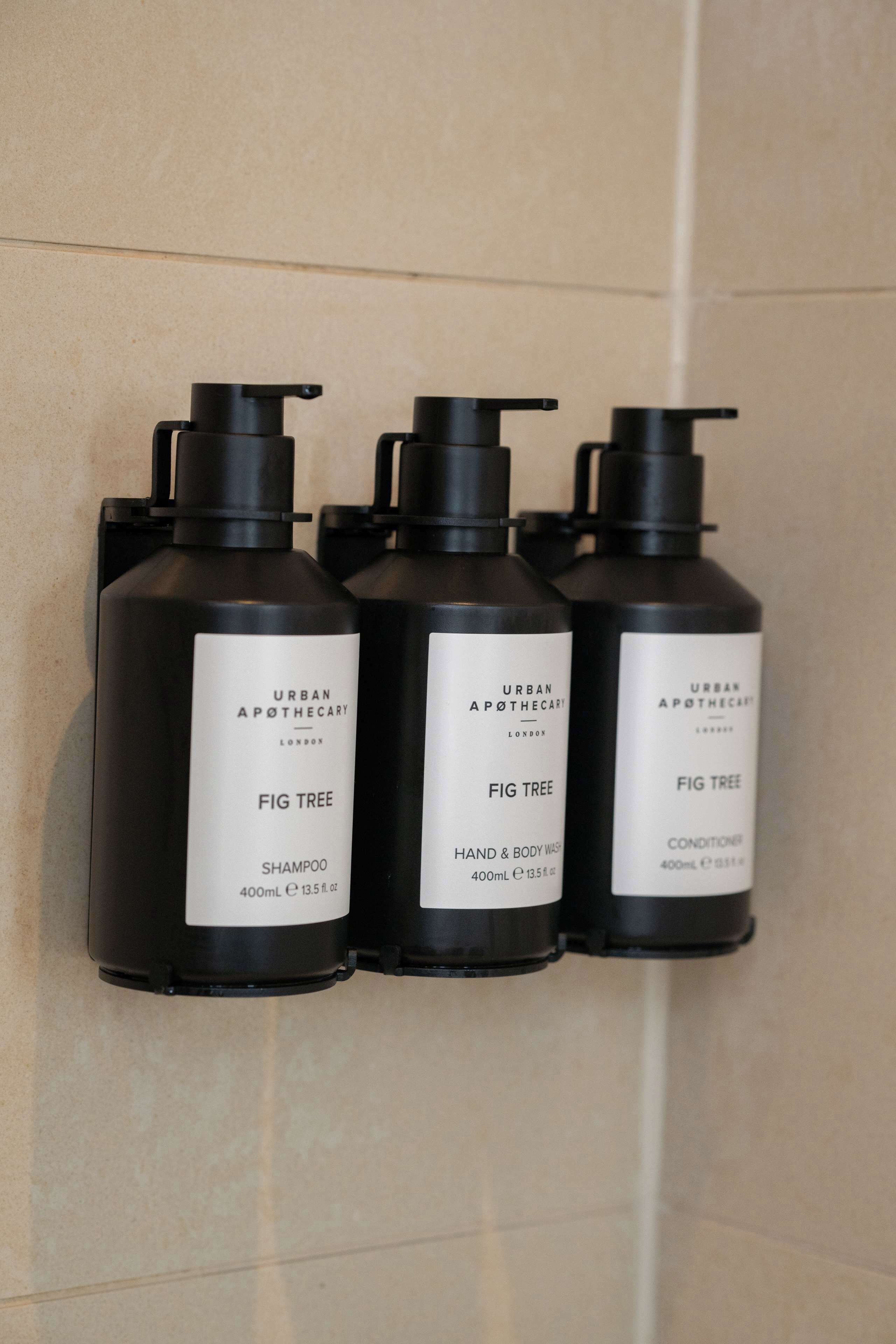 shower, designer toiletries, hair dryer, towels