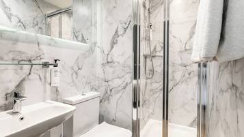 Shower, eco-friendly toiletries, hair dryer, towels