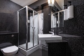 Shower, eco-friendly toiletries, hair dryer, towels