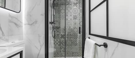 Shower, eco-friendly toiletries, hair dryer, towels