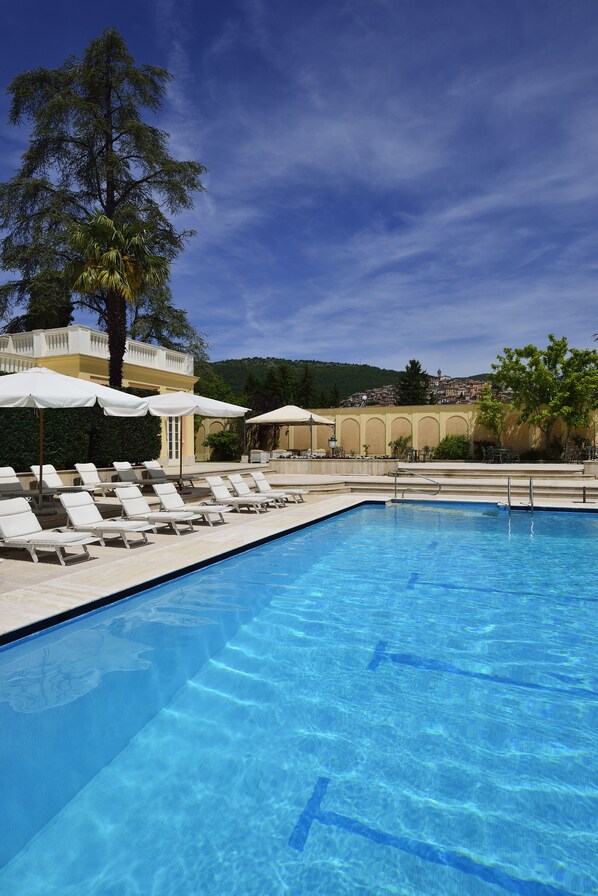 Indoor pool, outdoor pool, pool umbrellas, pool loungers