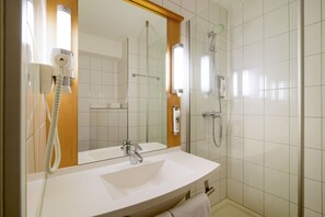 Shower, eco-friendly toiletries, hair dryer, towels