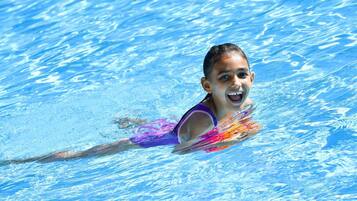 A person swimming in a pool.