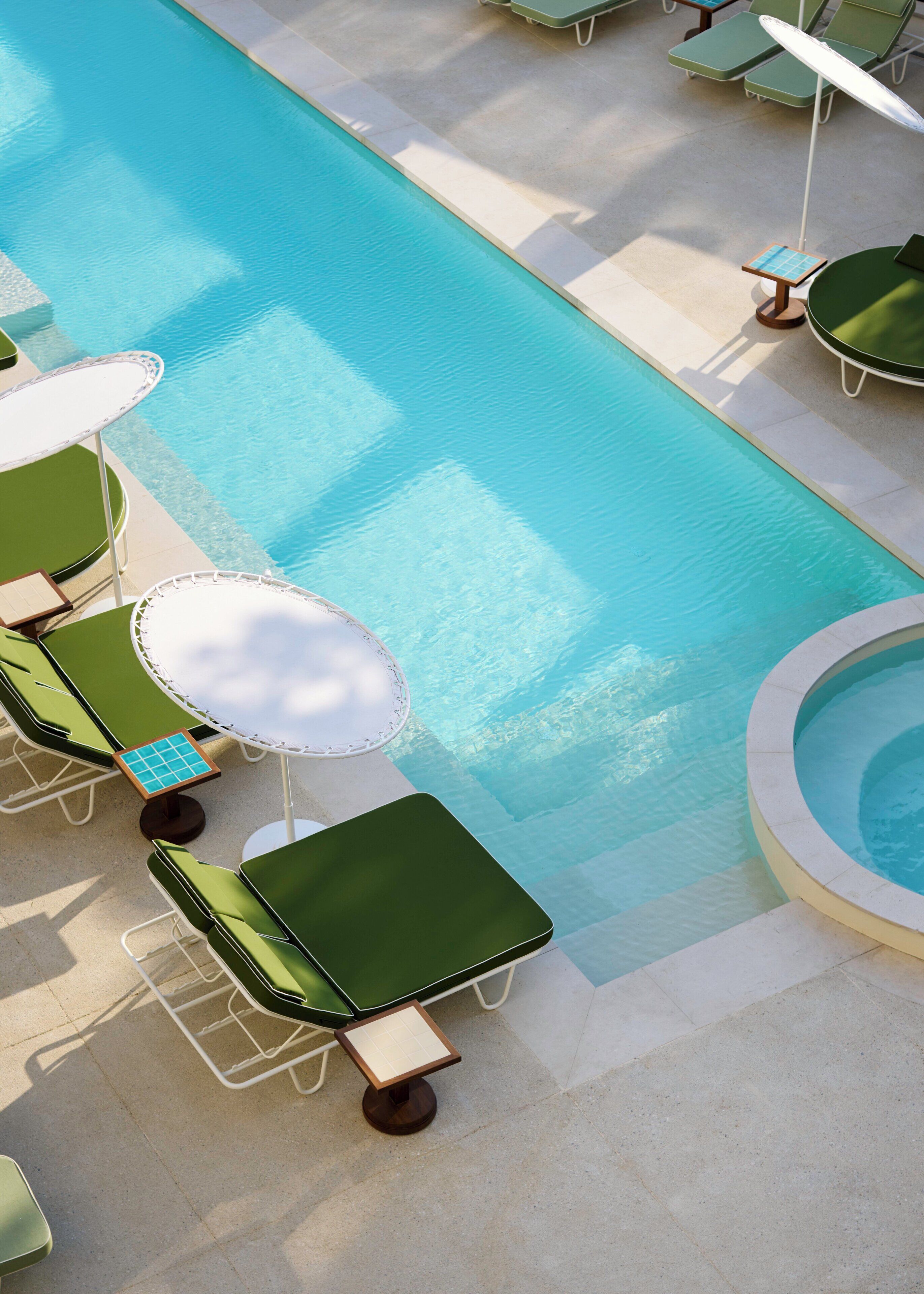 A pool area with sun loungers and a table with a solar-powered fan.