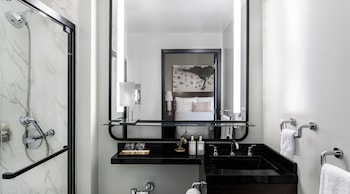 Combined shower/tub, designer toiletries, hair dryer, bathrobes at Hotel Emblem San Francisco
