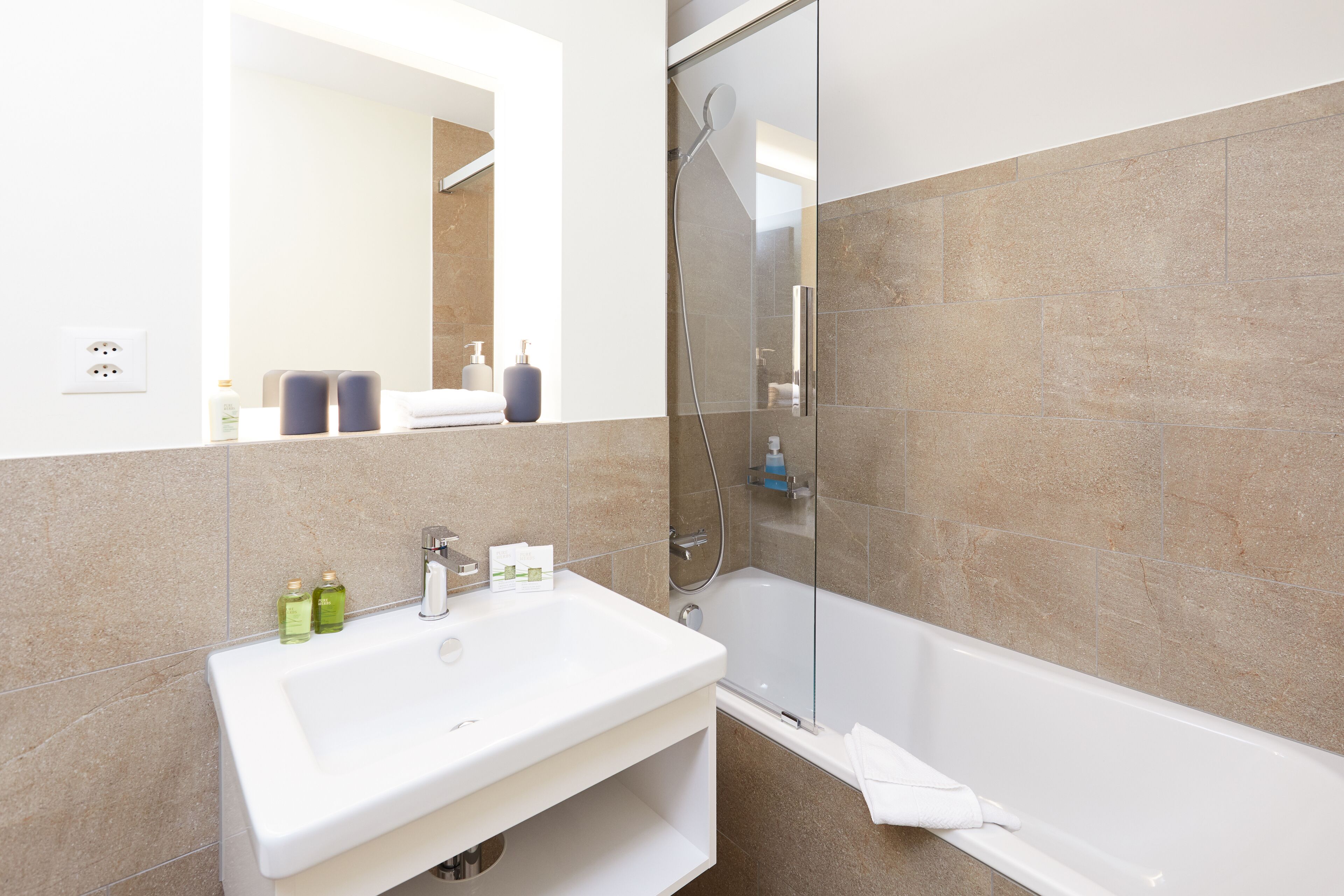 roof deluxe room | bathroom | shower, rainfall showerhead, eco-friendly toiletries, hair dryer
