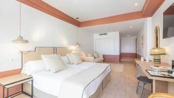 Standard Quadruple Room, Balcony | Minibar, in-room safe, desk, blackout drapes