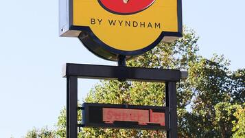 A sign with "Super 8" and "Welcome" text, indicating a location or establishment.