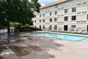 Seasonal outdoor pool, open 9 AM to 10 PM, pool umbrellas