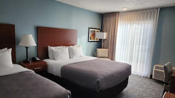 Suite, Multiple Beds, Non Smoking | Desk, laptop workspace, blackout drapes, iron/ironing board