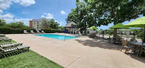 Seasonal outdoor pool, open 9 AM to 10 PM, pool umbrellas