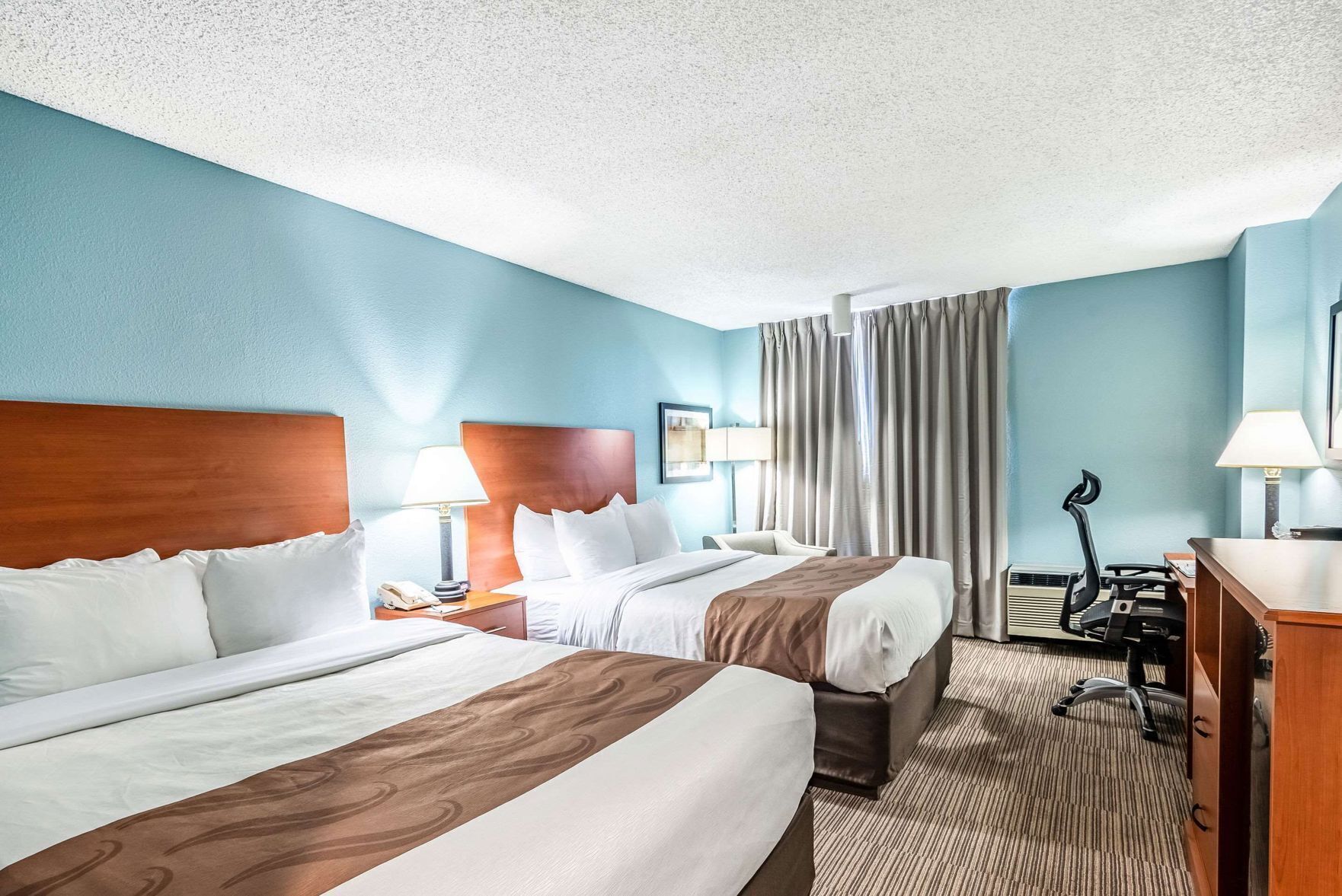 Desk, laptop workspace, blackout curtains, iron/ironing board