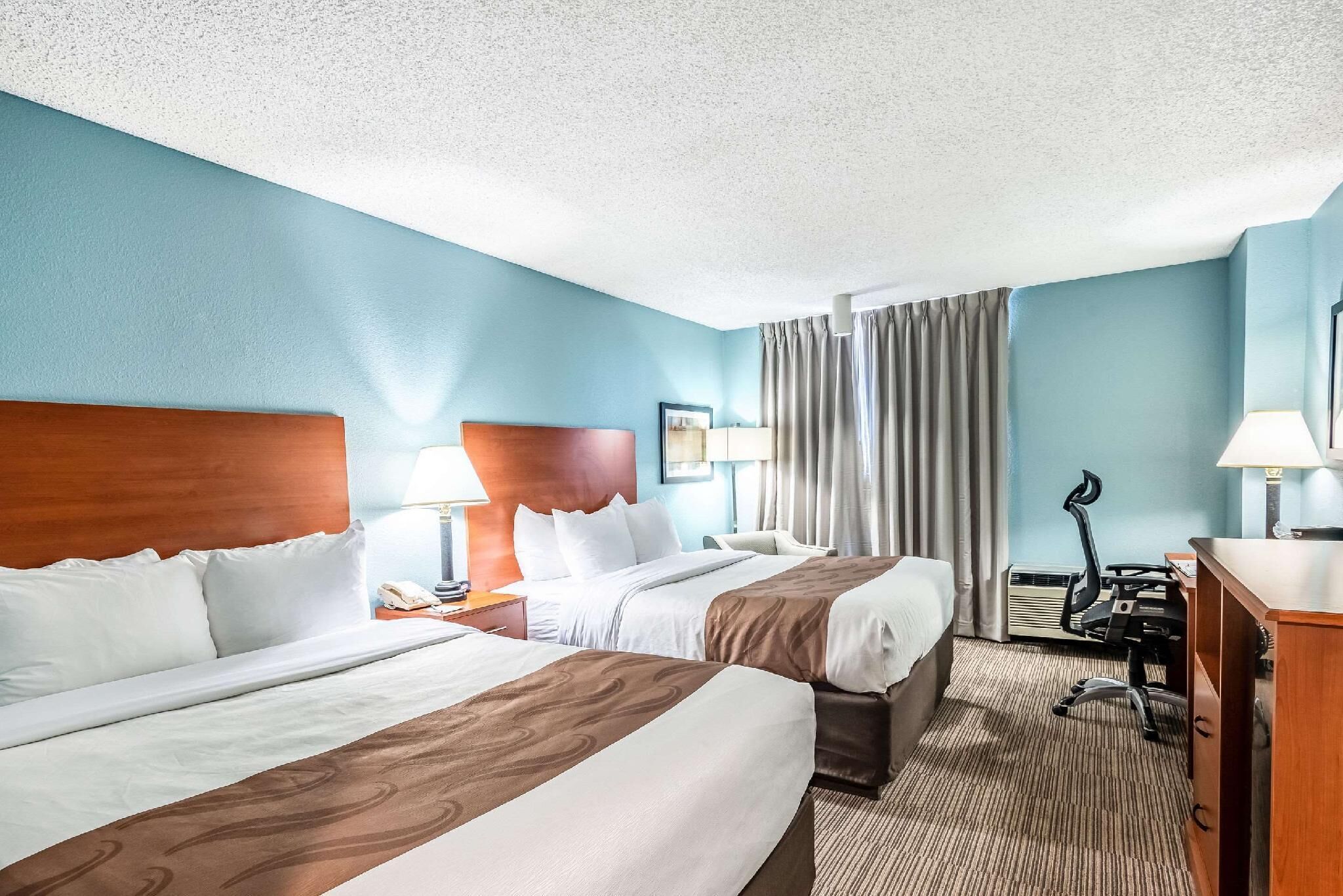 Desk, laptop workspace, blackout curtains, iron/ironing board