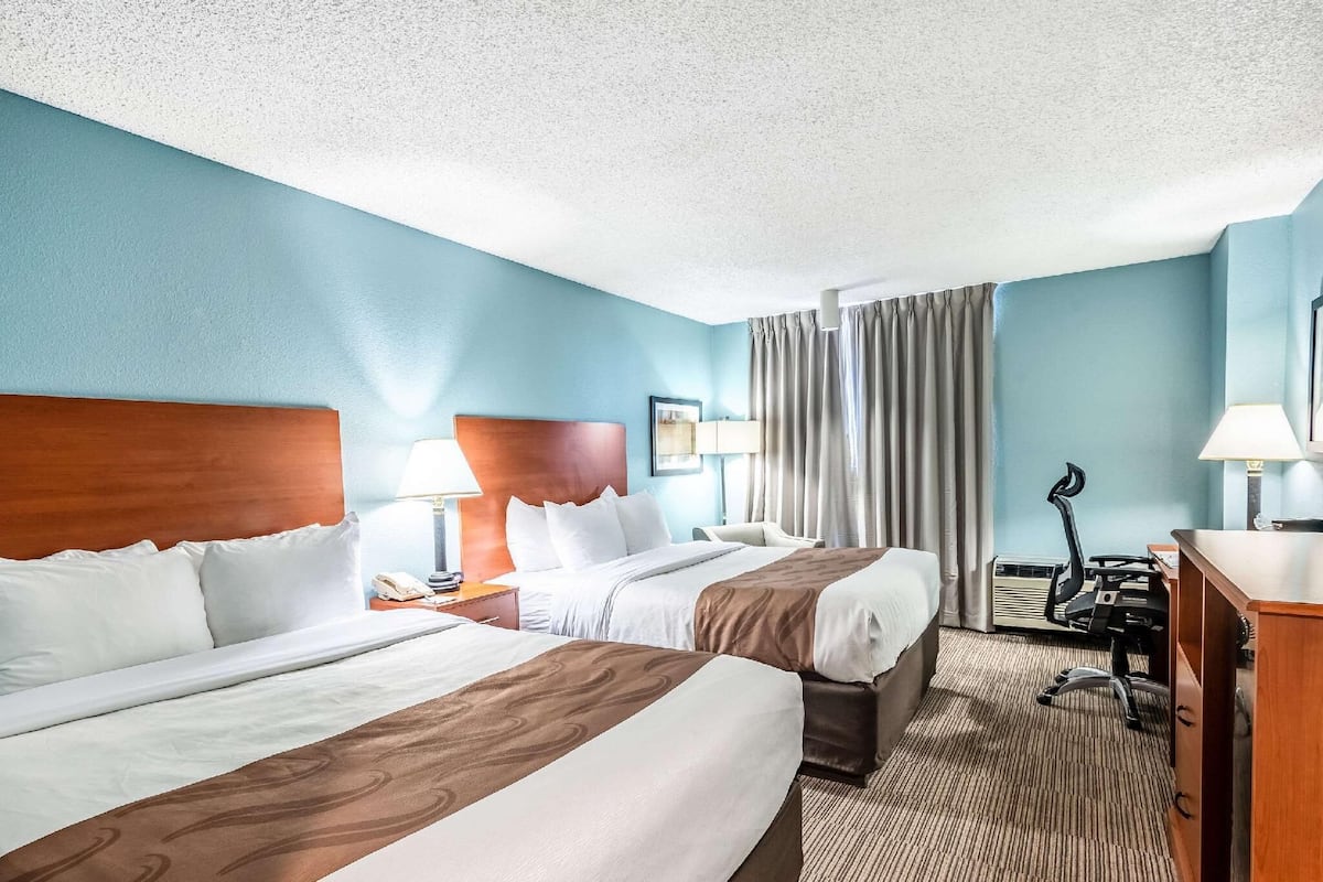 Desk, laptop workspace, blackout curtains, iron/ironing board