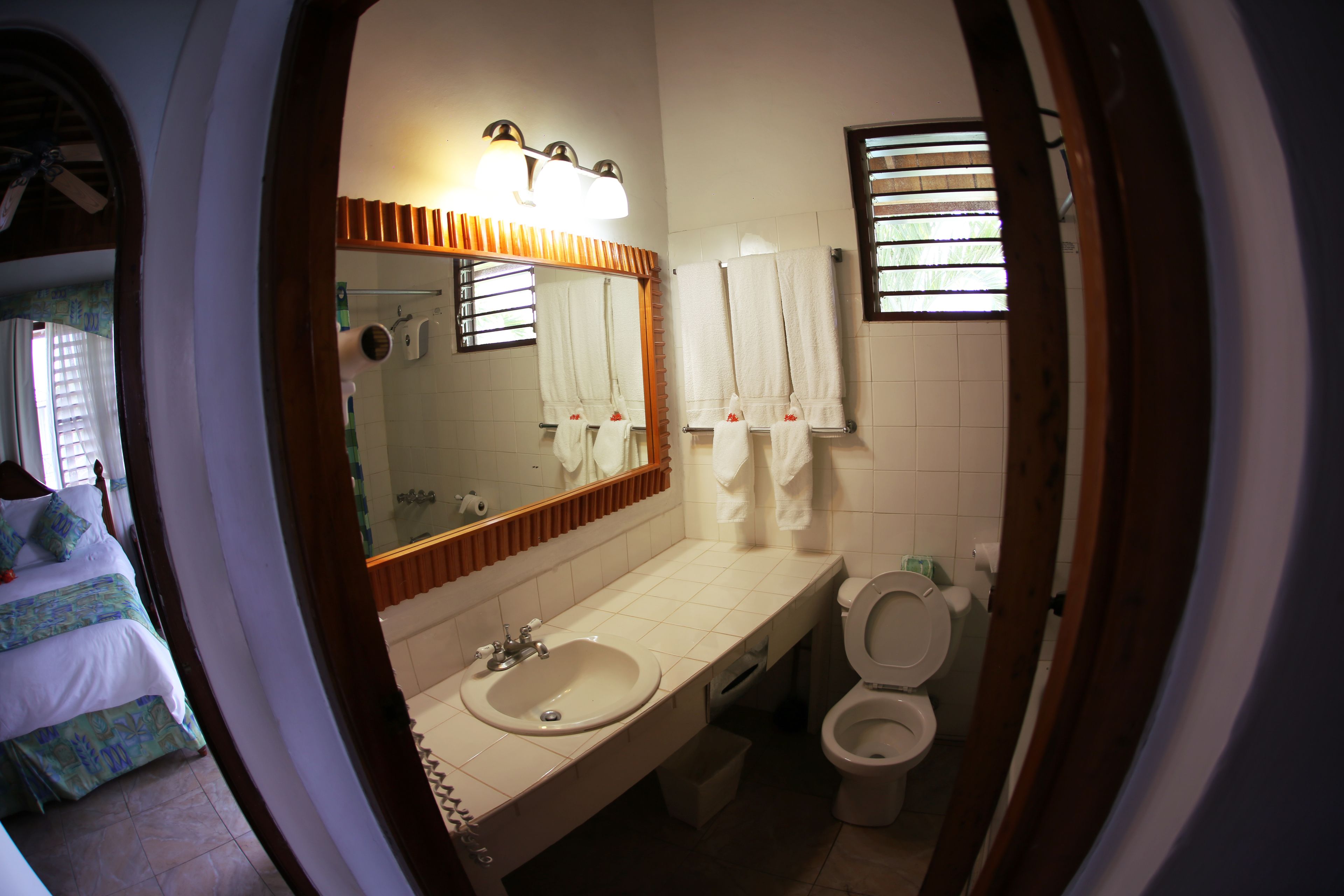 suite, garden view | bathroom | rainfall showerhead, eco-friendly toiletries, towels, shampoo