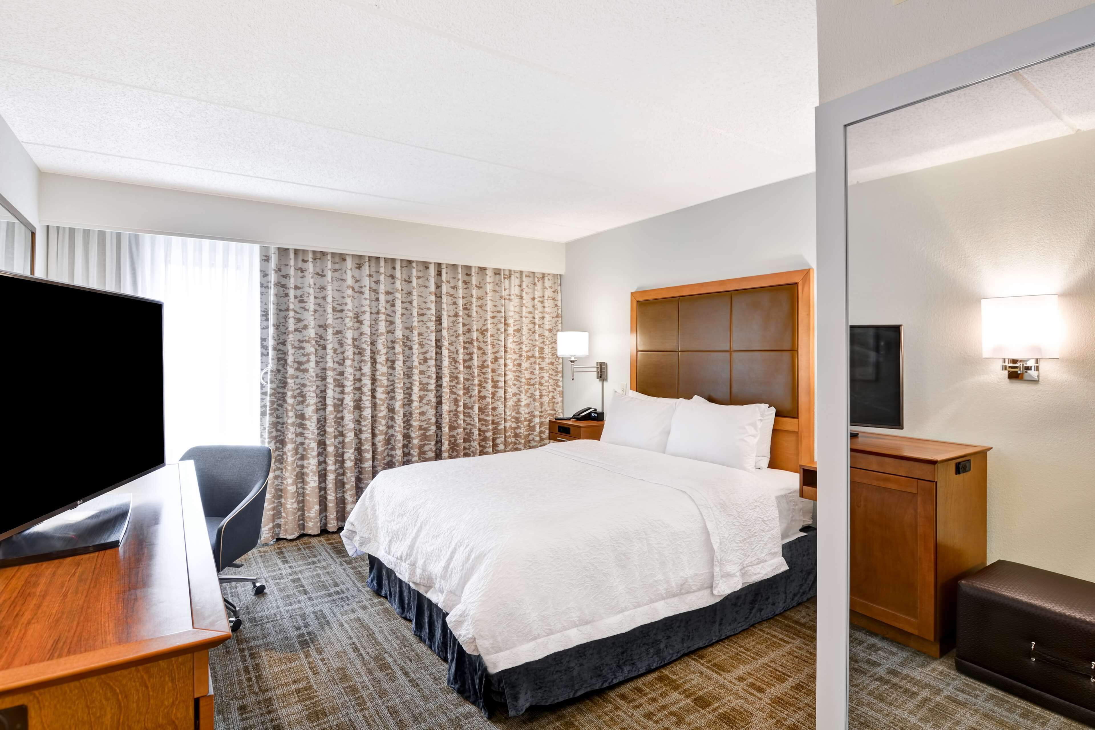 desk, laptop workspace, blackout curtains, iron/ironing board