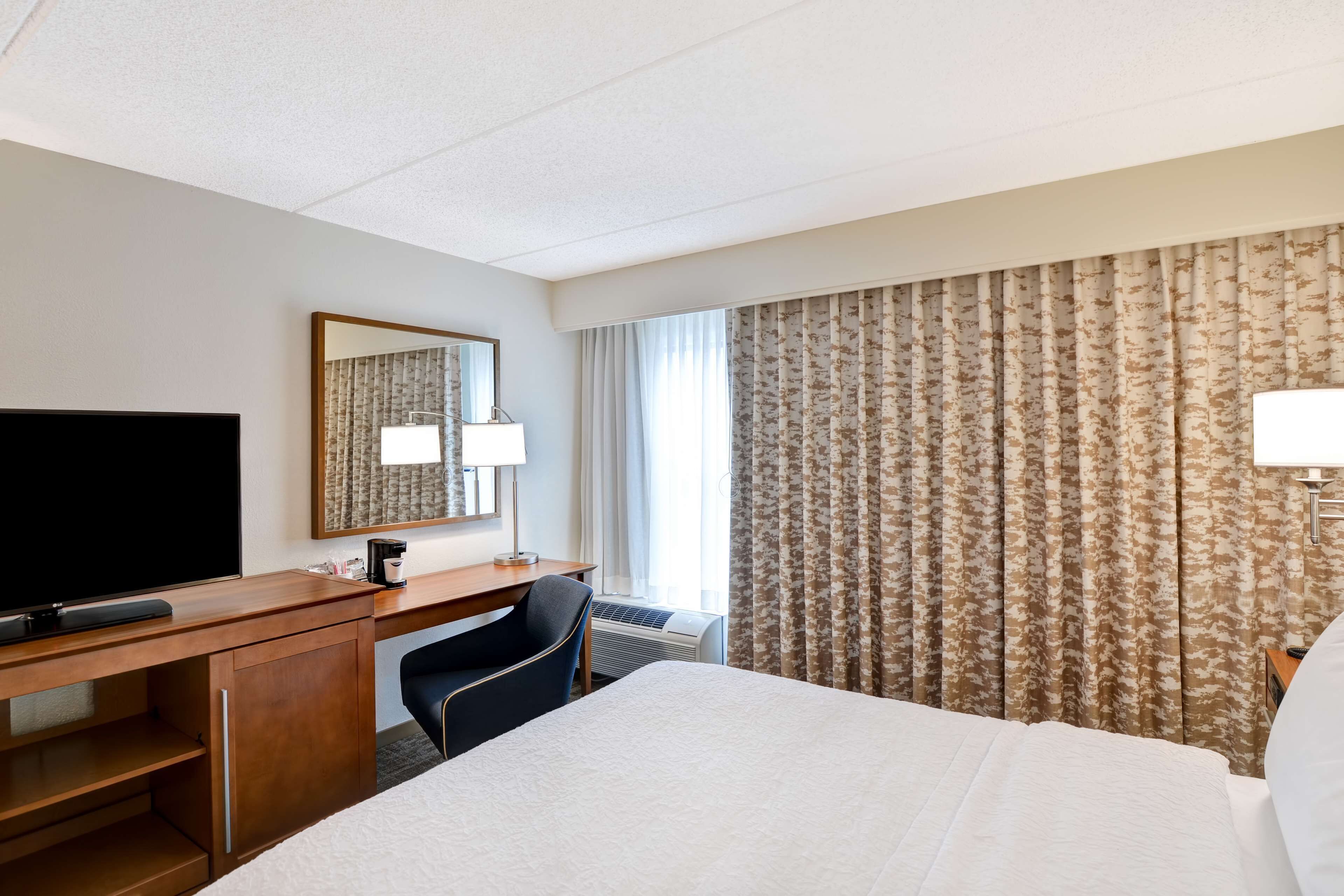 desk, laptop workspace, blackout curtains, iron/ironing board