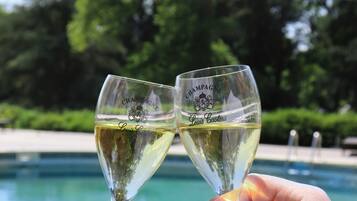 Seasonal outdoor pool, open 10:00 AM to 9:00 PM, pool umbrellas