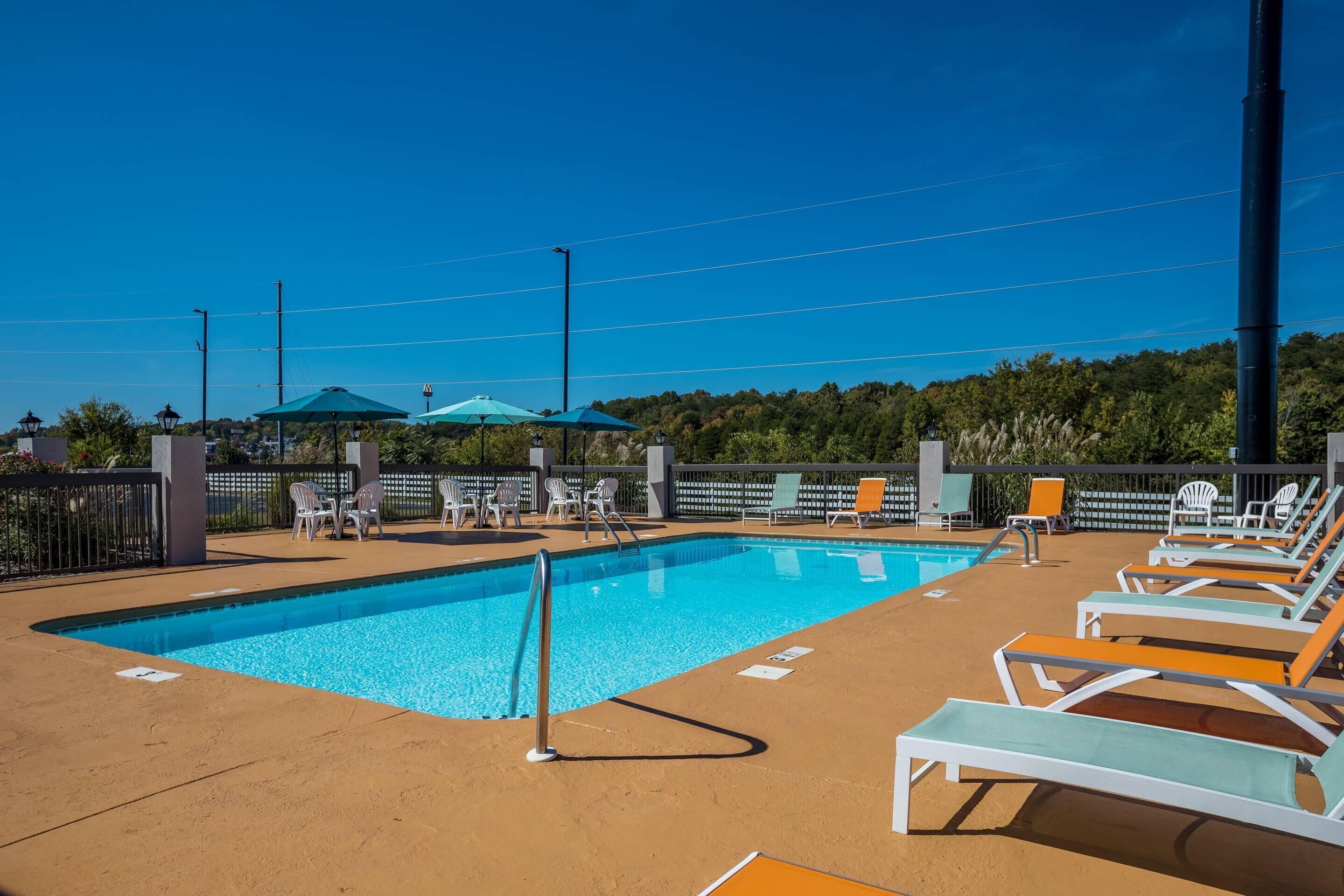 Seasonal outdoor pool, open 10 AM to 11 PM, pool loungers
