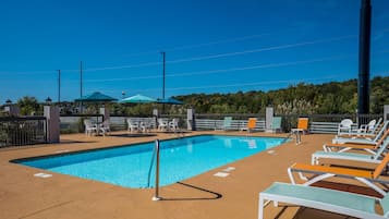Seasonal outdoor pool, open 10 AM to 11 PM, pool loungers
