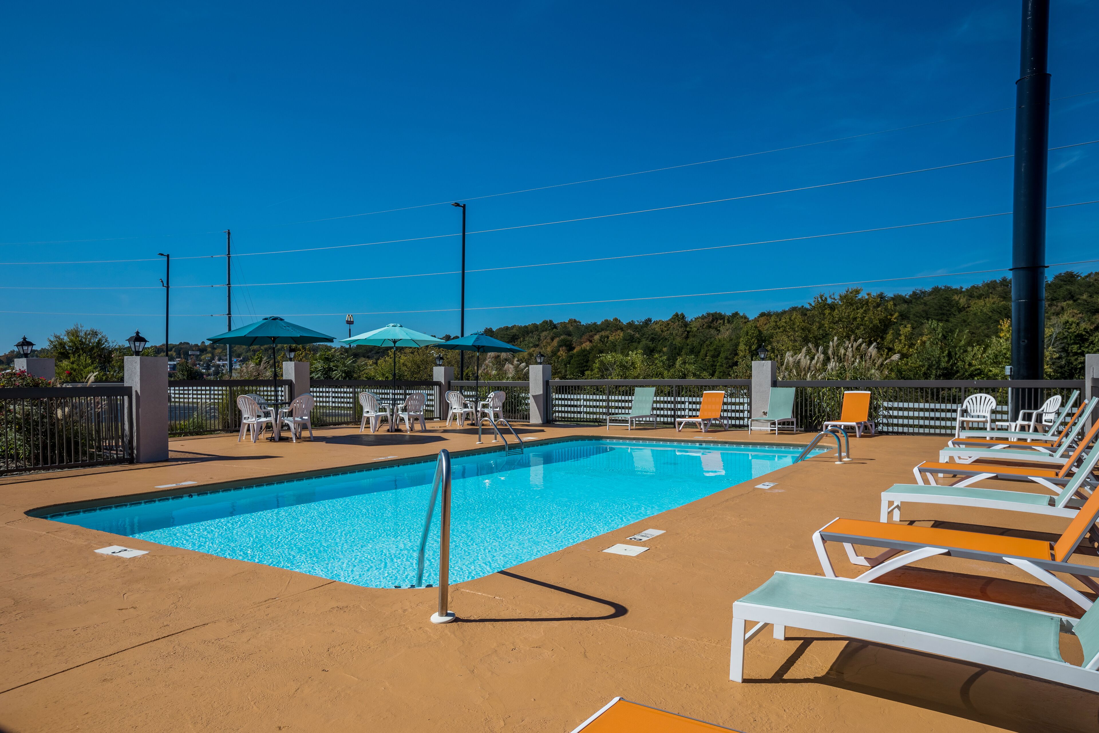 seasonal outdoor pool, open 10 am to 11 pm, pool loungers
