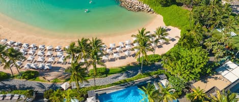 On the beach, white sand, beach cabanas, beach umbrellas