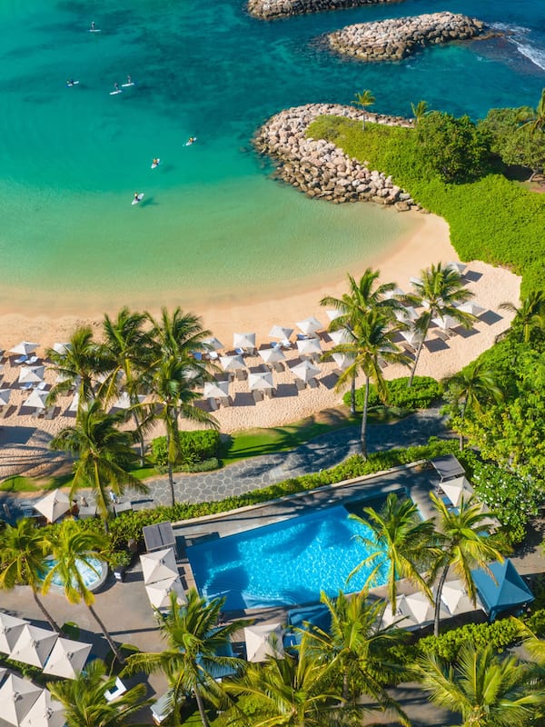 On the beach, white sand, beach cabanas, beach umbrellas