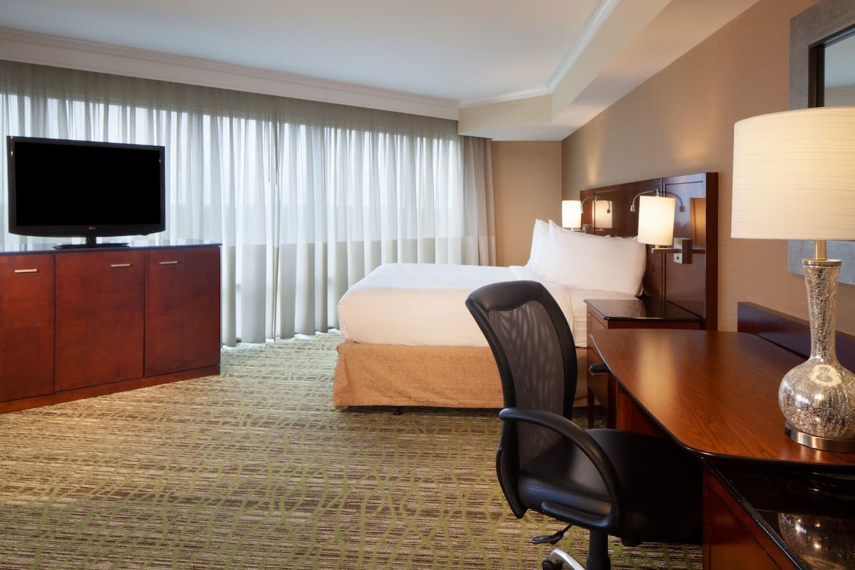 Larger Guestroom - 1 King Corner Room | Premium bedding, in-room safe, desk, blackout drapes